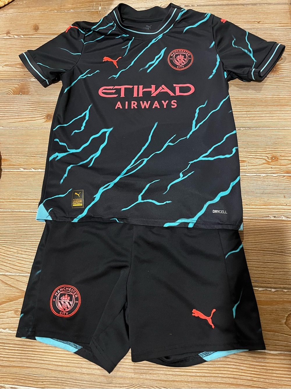 Puma Kids Black Jersey Set with Teal Lightning and Coral Logos